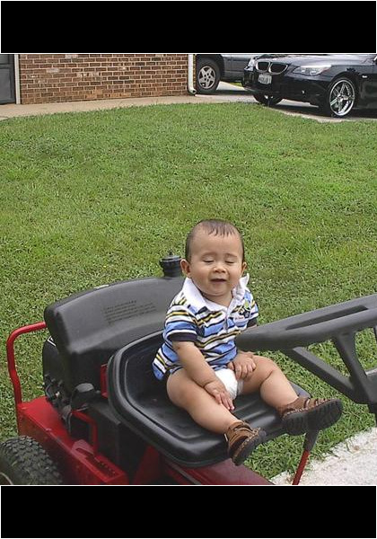Jarred and the Snapper! Ten more years before he will be cutting the grass!