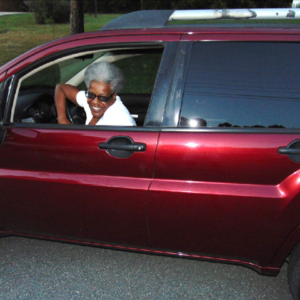 Celonia Saunders in her Mitsubishi SUV!