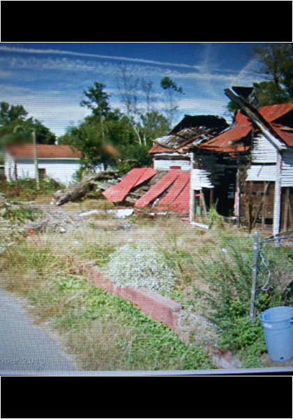 I wonder what happened to it? It looks like a fire, but it is the same house, the wall around it is red!
