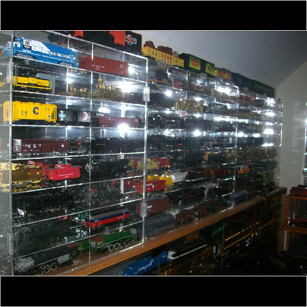 Wiley installed glass cases for his special rare and special locomotives and train cars. The cases went from one wall to the other!