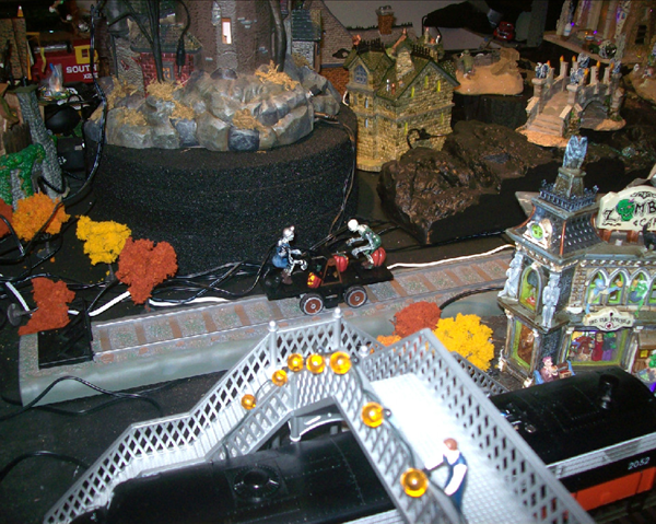 Two skeletons on a hand car....There is also a fisherman in a lake! Two skeletons on a hand car....There is also a fisherman in a lake!