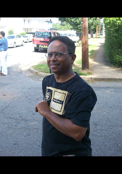 "Baby Brother" Wood, taking in all the festivities from his home across the street!