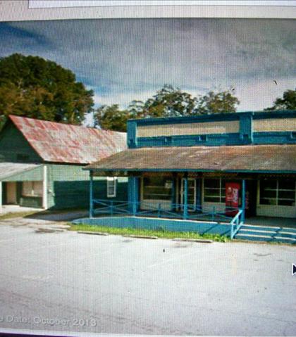 This is the only building cluster up the street! The railings have been painted green, the cross is missing from the church next door, and the electric meter is in the same place! Looks like it's for sale? This is the only building cluster up the street! The railings have been painted green, the cross is missing from the church next door, and the electric meter is in the same place! Looks like it's for sale?